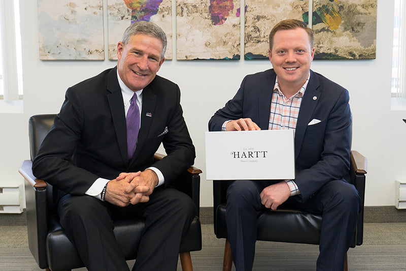 CEO and Deputy Minister of Opportunities New Brunswick, Steven Lund (left) poses for a photo with Hartt Shoe Company CEO, Andrew Bedford.