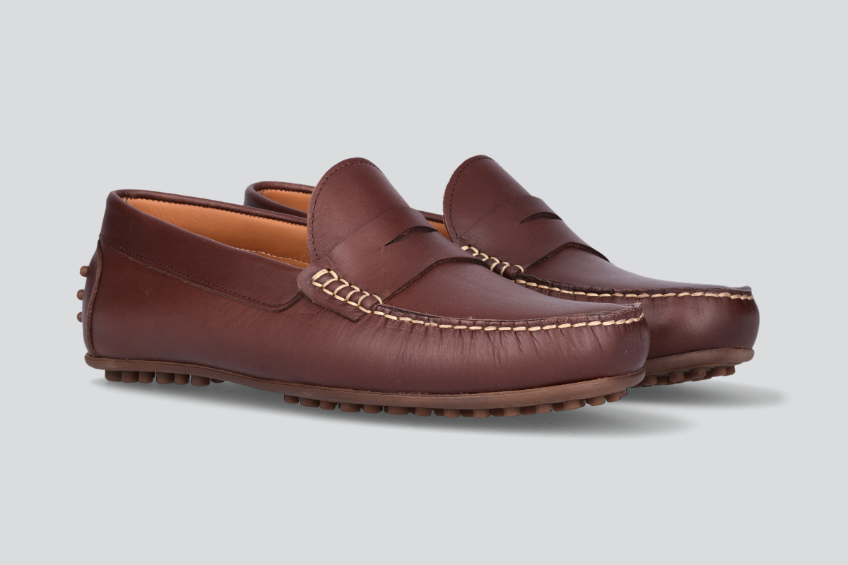 A pair of dark brown men's miles driver loafers from the Hartt Shoe Company