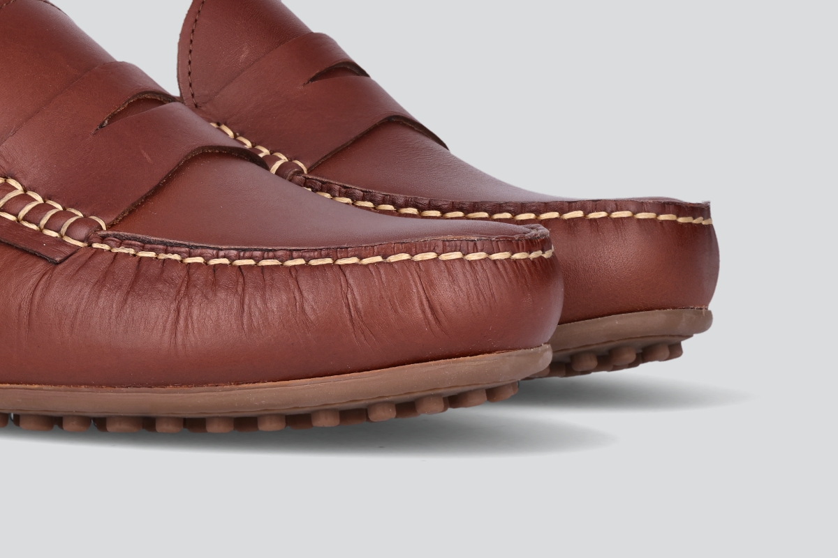 The toes of a pair of bourbon men's miles driver loafers from the Hartt Shoe Company