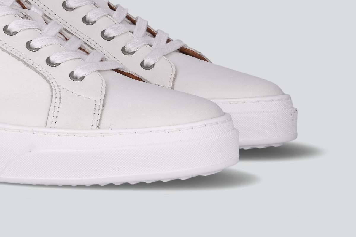 The toes of white men's low top sneaker from the Hartt Shoe Company