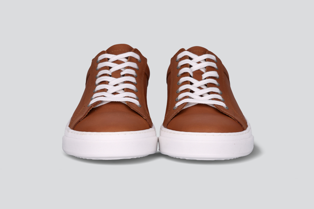 The front of cognac men's low top sneaker from the Hartt Shoe Company