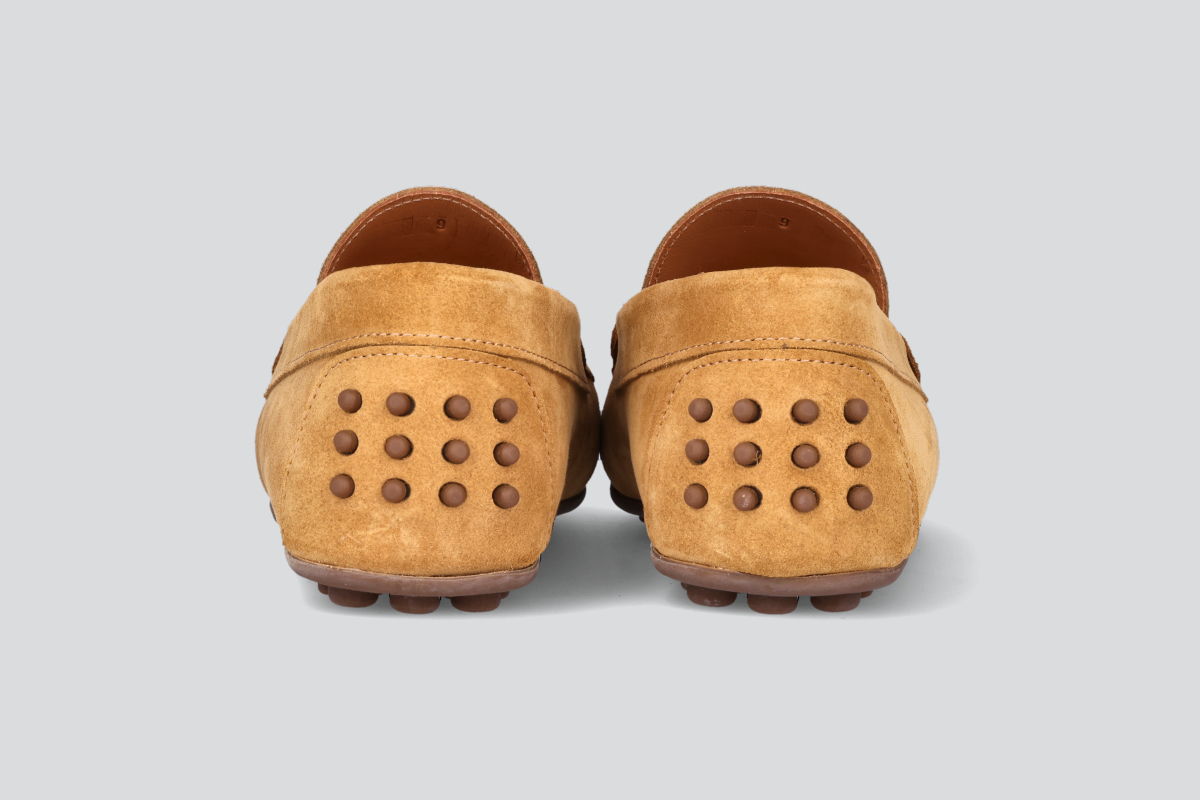 The heels of tan men's miles driver loafers from the Hartt Shoe Company