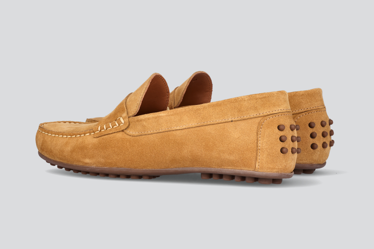 A pair of tan men's miles driver loafers from the Hartt Shoe Company