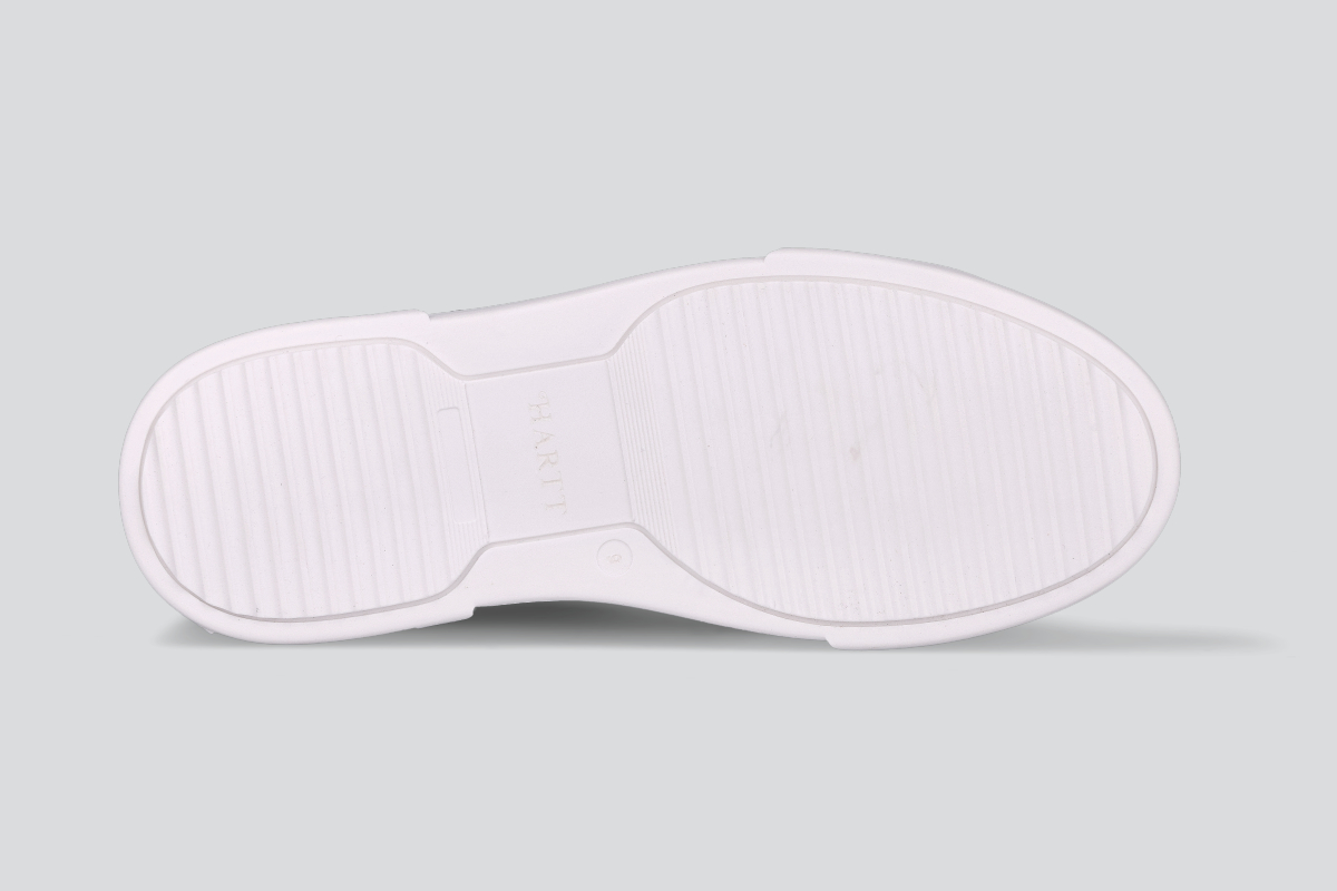 The sole of a cognac men's low top sneaker from the Hartt Shoe Company