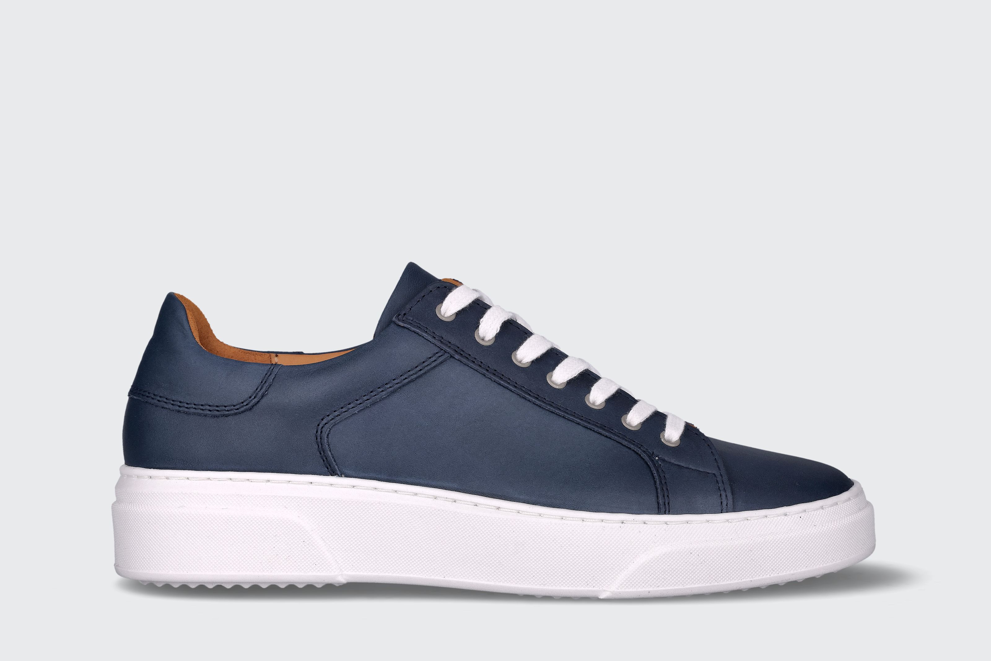 A navy men's low top sneaker from the Hartt Shoe Company