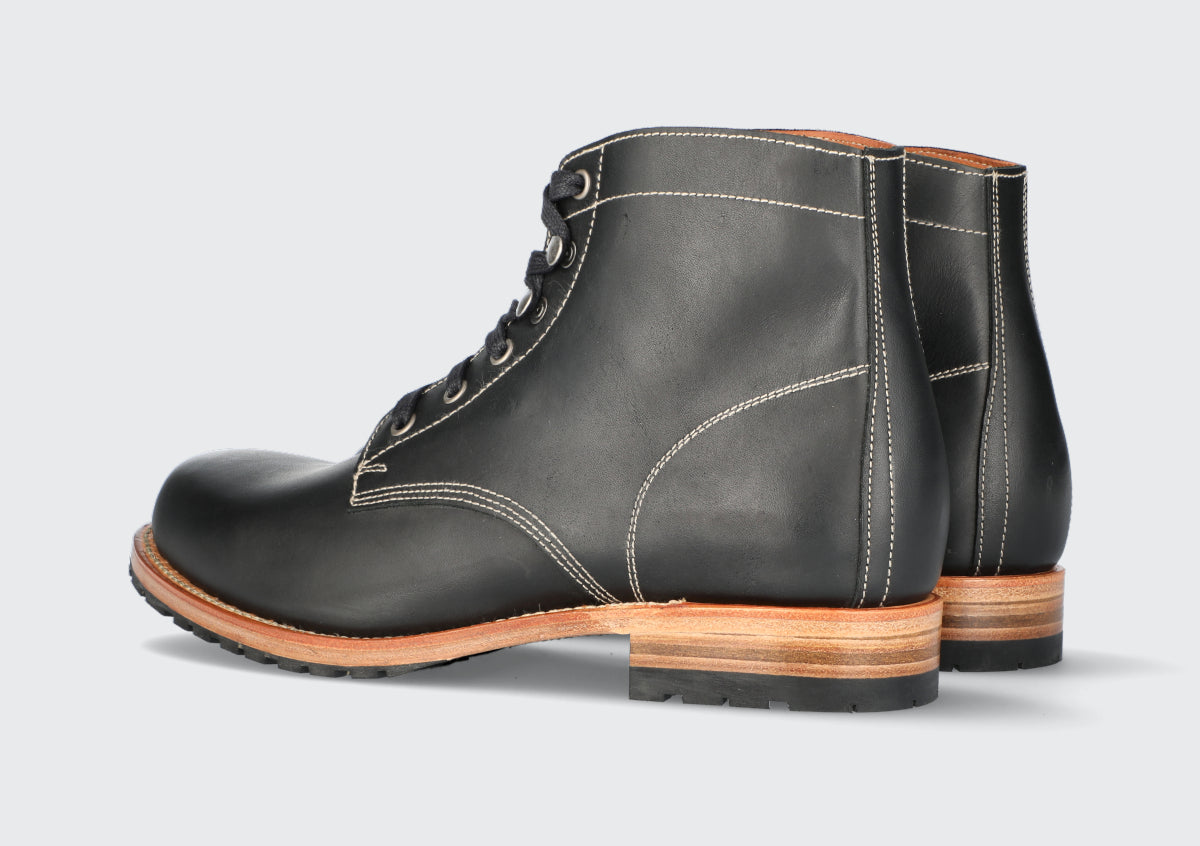 A pair of men's black leather boots from the Hartt Shoe Company