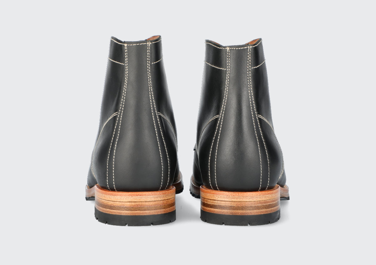 The heels of a pair of men's black leather boots