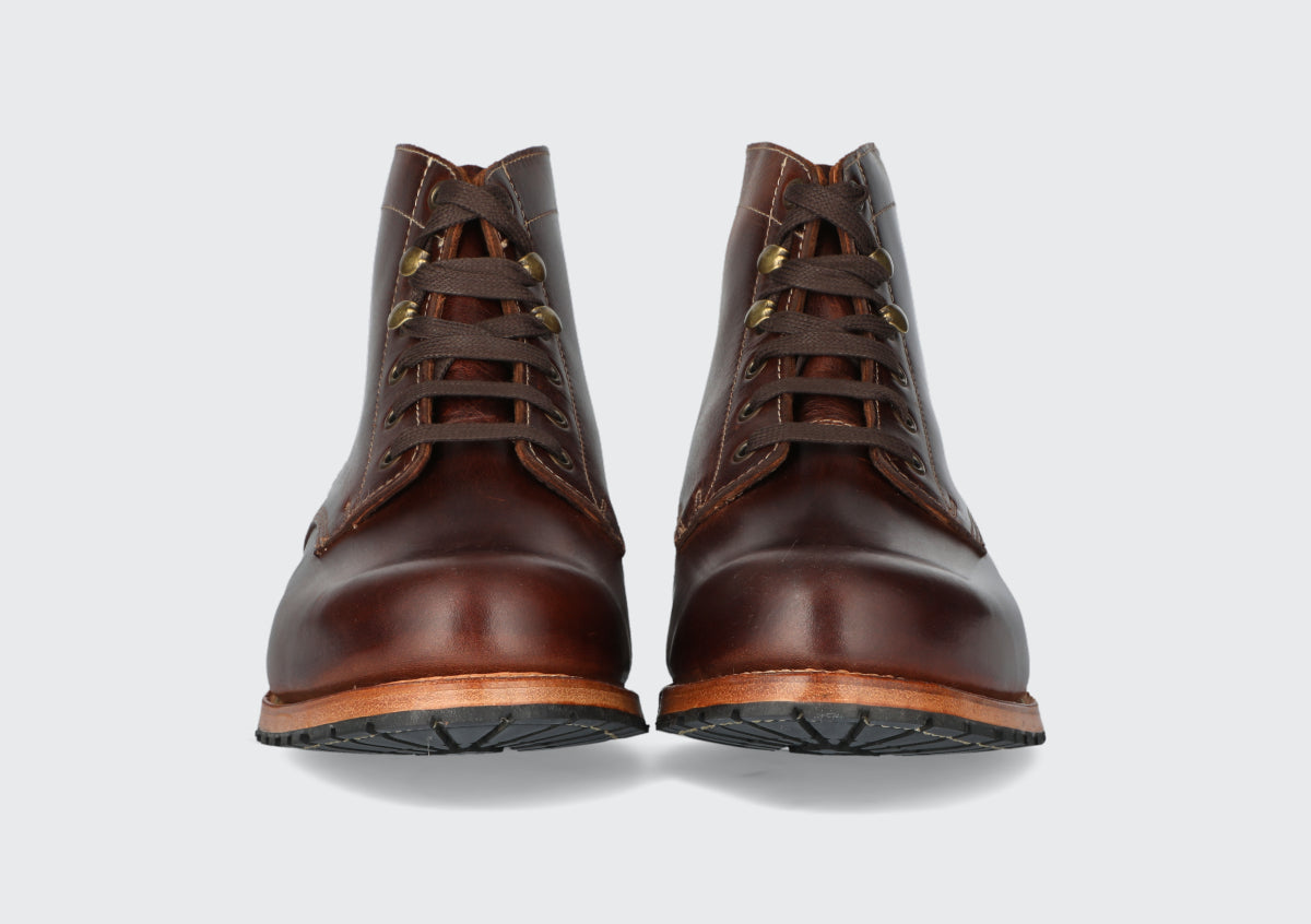 The front of a pair of men's oxblood leather boots