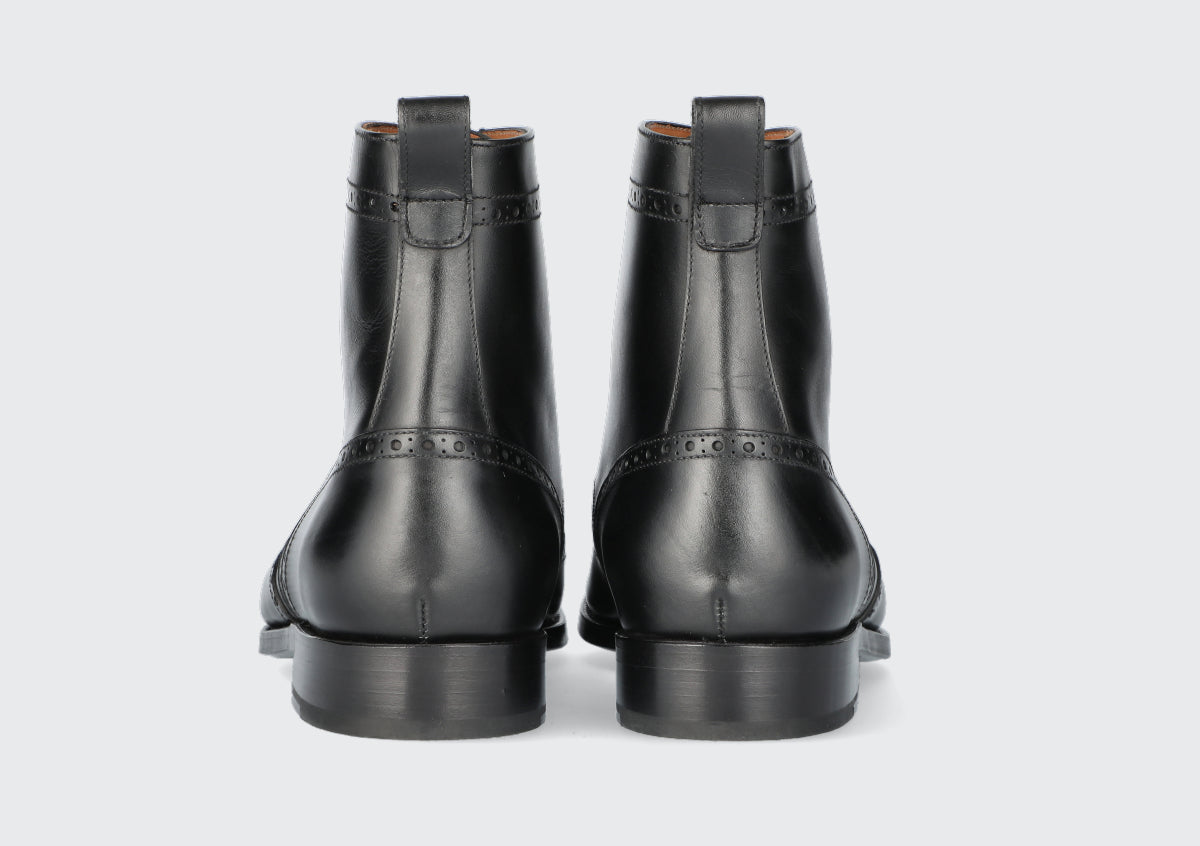 The heels of a pair of men's dress boots from the Hartt Shoe Company