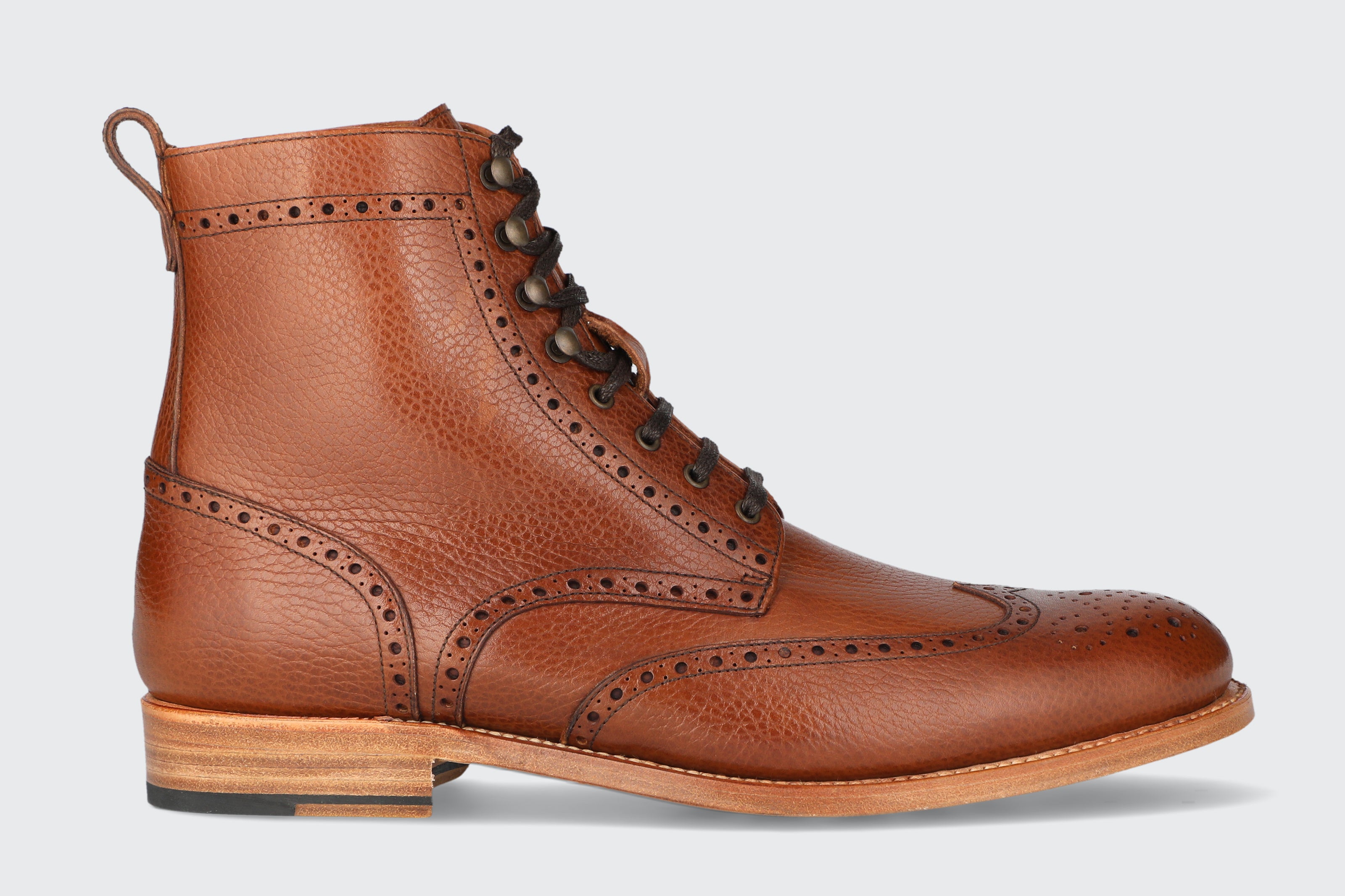 A pair of brown leather dress boots from the Hartt Shoe Company