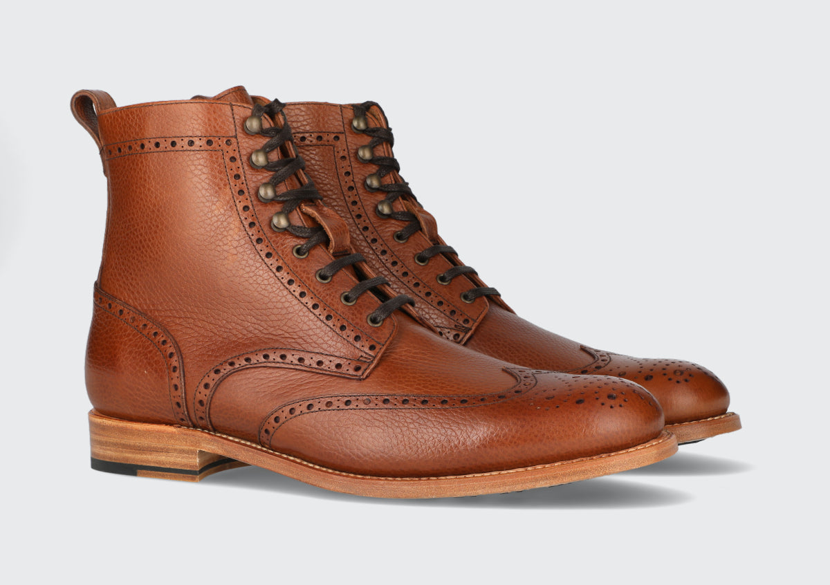 A pair of brown leather leather dress boots from the Hartt Shoe Company