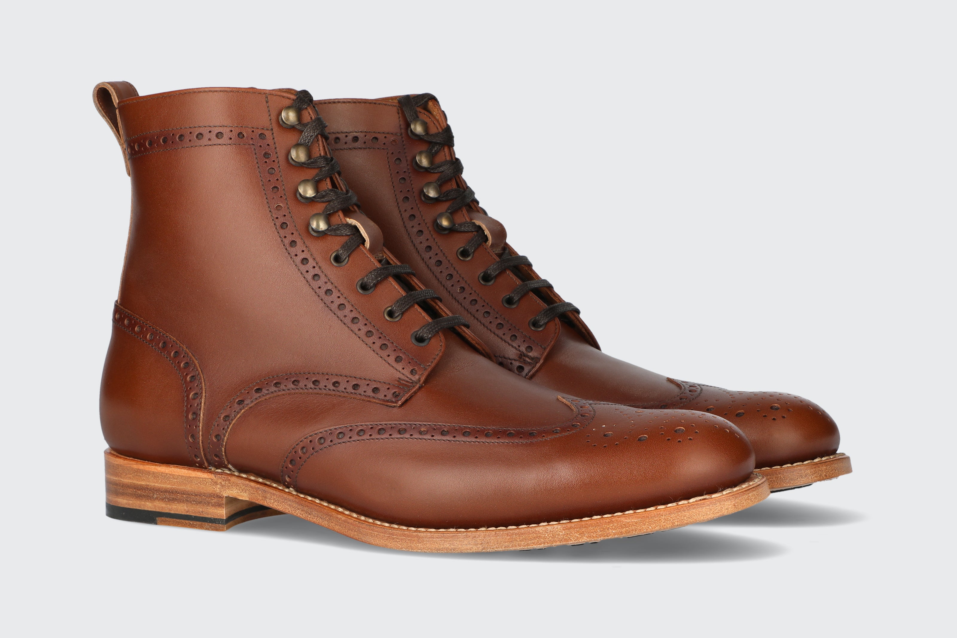 A pair of brown leather dress boots from the Hartt Shoe Company