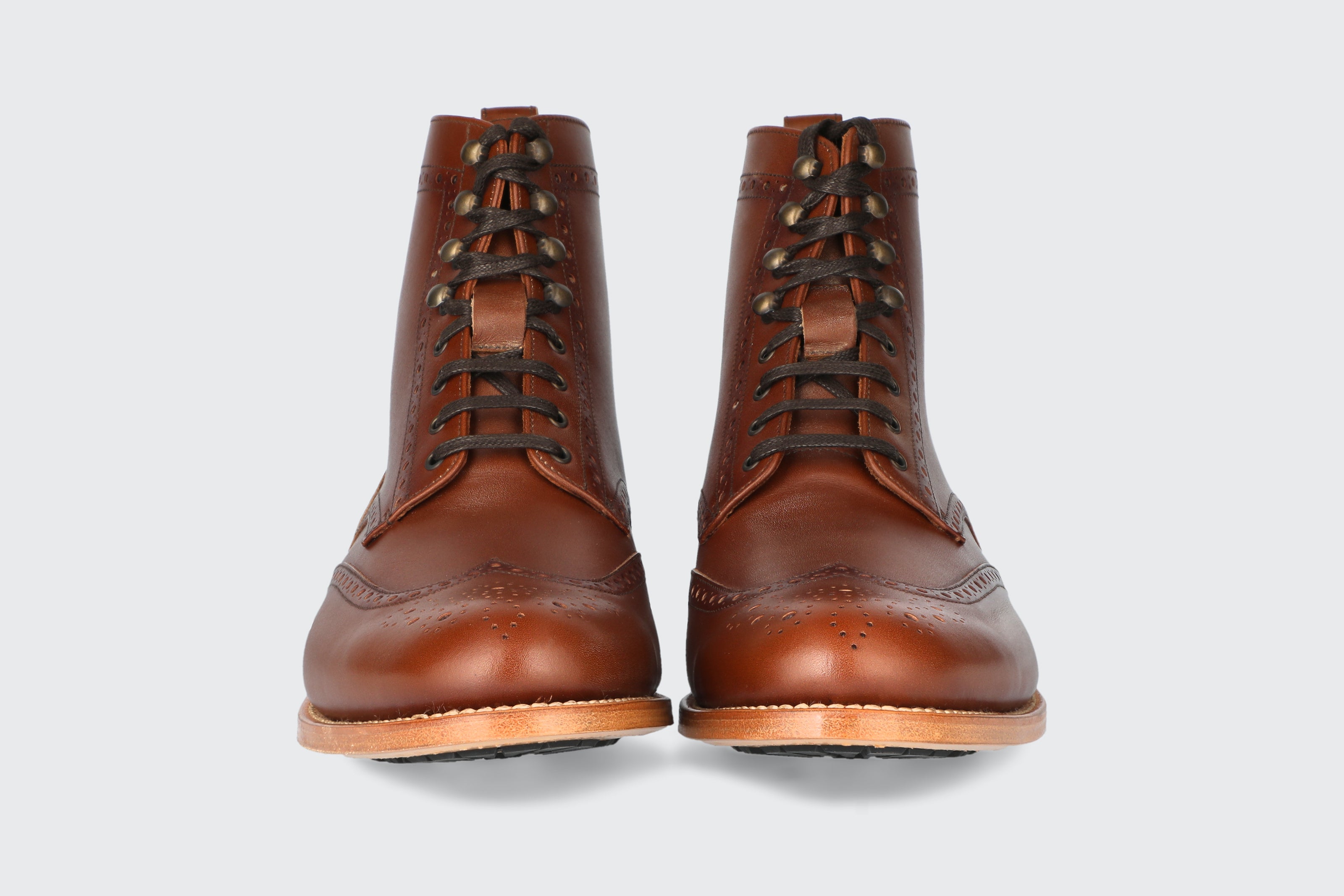 The front of a pair of brown leather dress boots from the Hartt shoe company