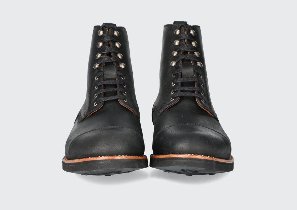 The front of a pair of black leather brewer's boots from the Hartt Shoe Company