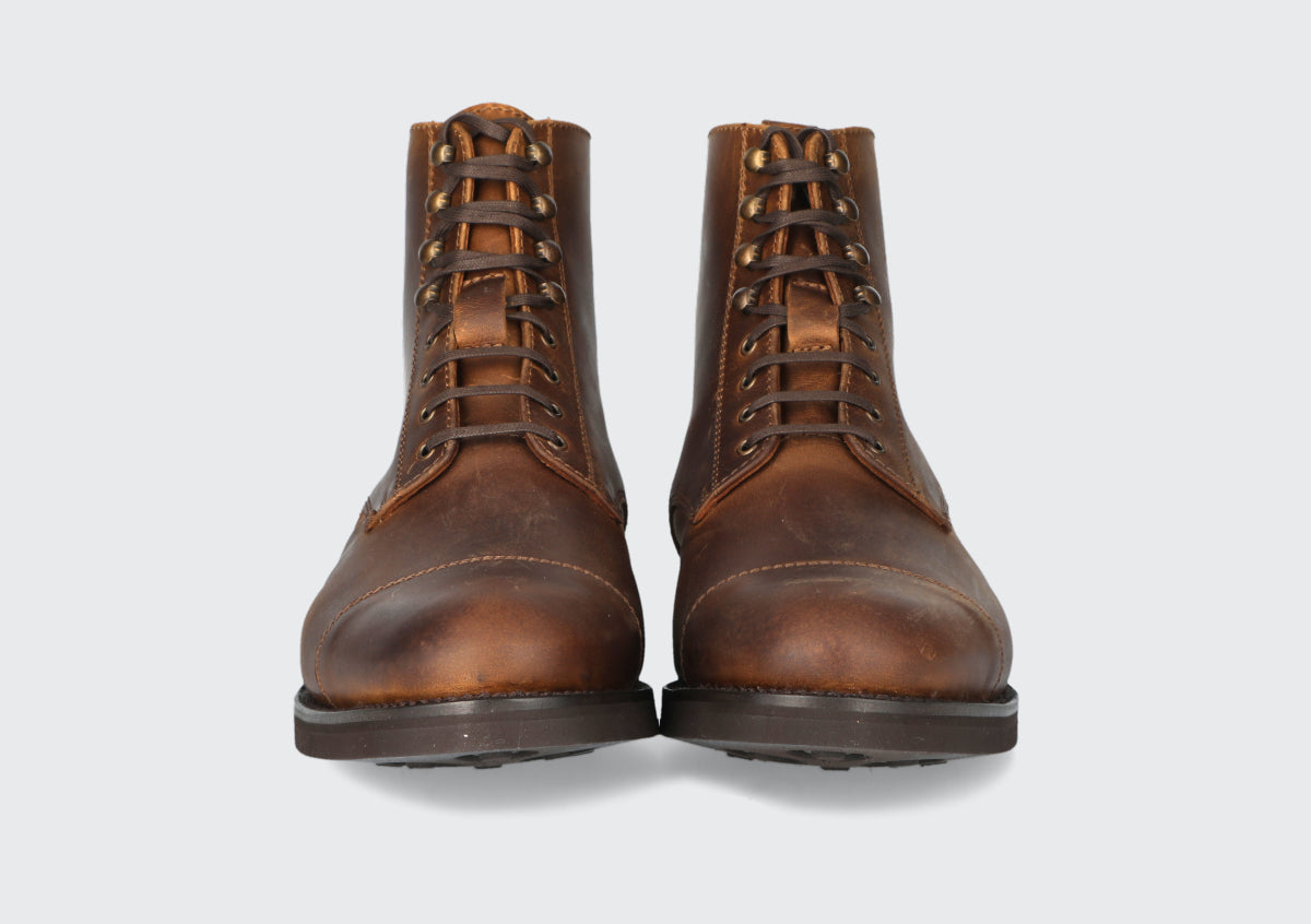 The front of a pair of tan leather boots from the Hartt Shoe Company