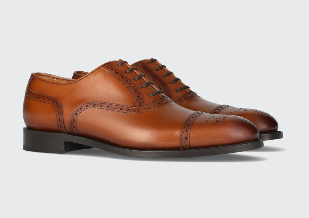 A pair of men's brown leather dress shoes from the Hartt Shoe Company