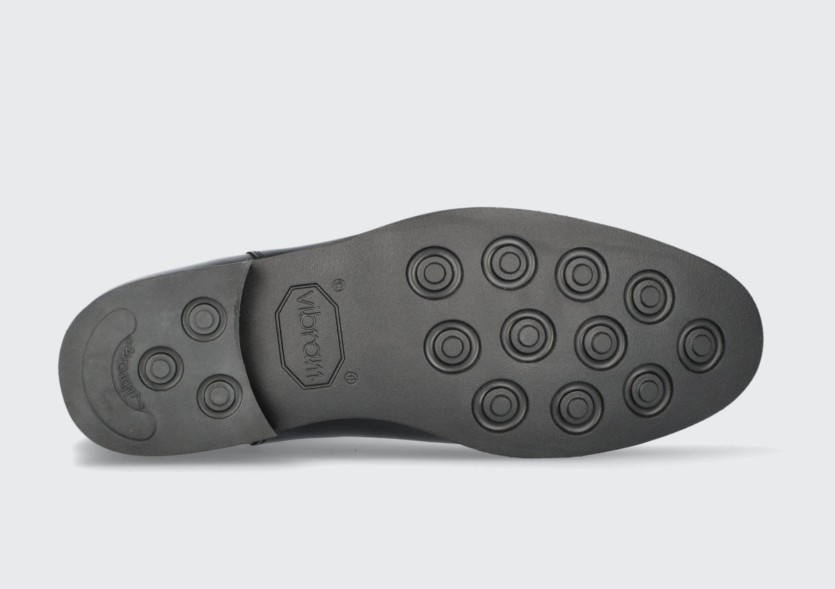 The vibram soles of a pair of goodyear welted boots from the Hartt Shoe company