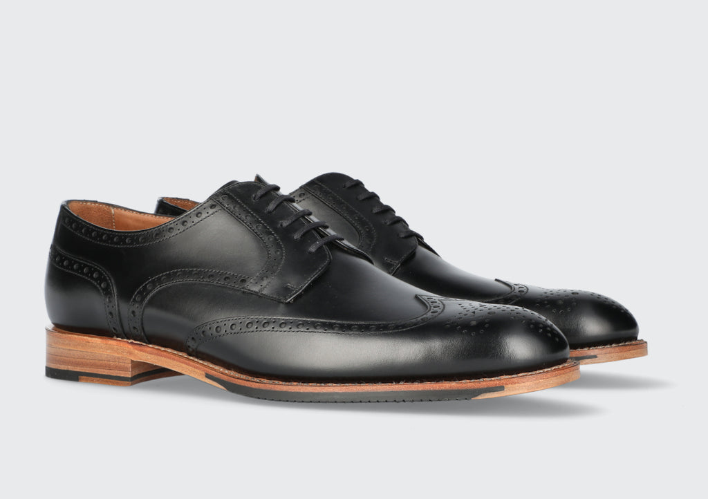 A pair of black leather derby dress shoes from the Hartt Shoe Company
