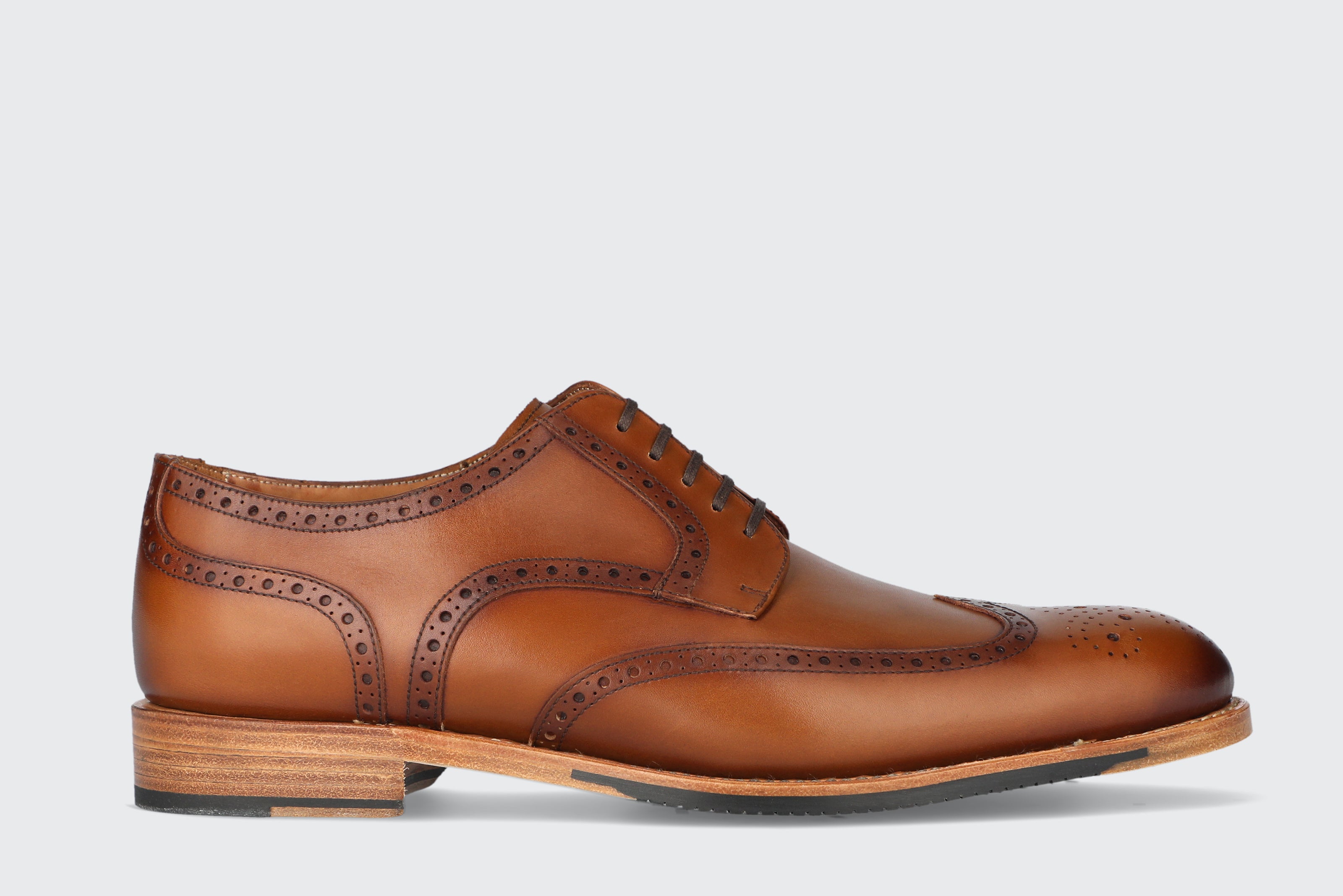A men's brown leather dress shoe from the Hartt Shoe Company