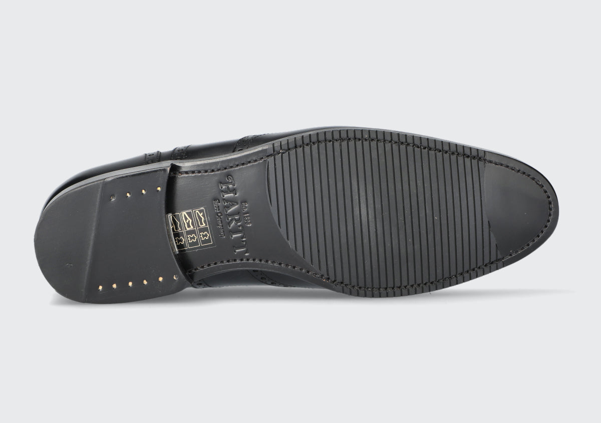 The sole of a black leather goodyear welted dress shoe from the Hartt Shoe Company