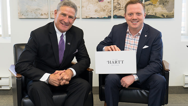 CEO and Deputy Minister of Opportunities New Brunswick, Steven Lund (left) poses for a photo with Hartt Shoe Company CEO, Andrew Bedford.