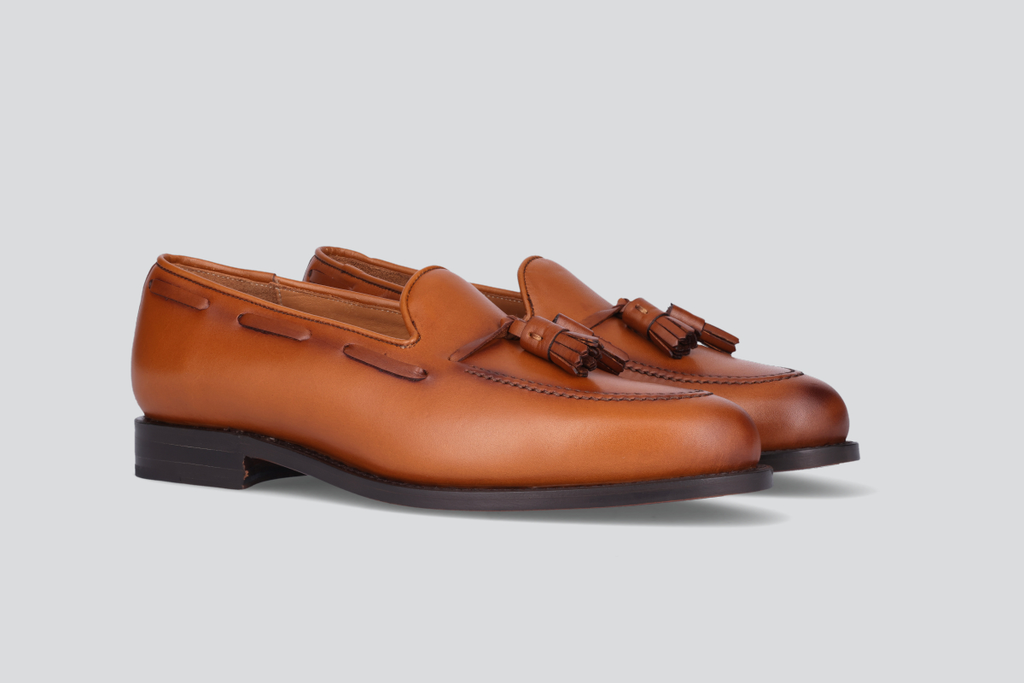 A pair of brown men's mckenna loafers from the Hartt Shoe Company