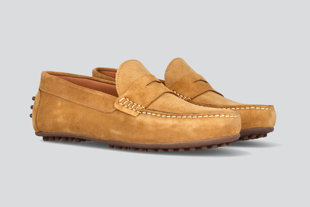 A pair of tan men's miles driver loafers from the Hartt Shoe Company