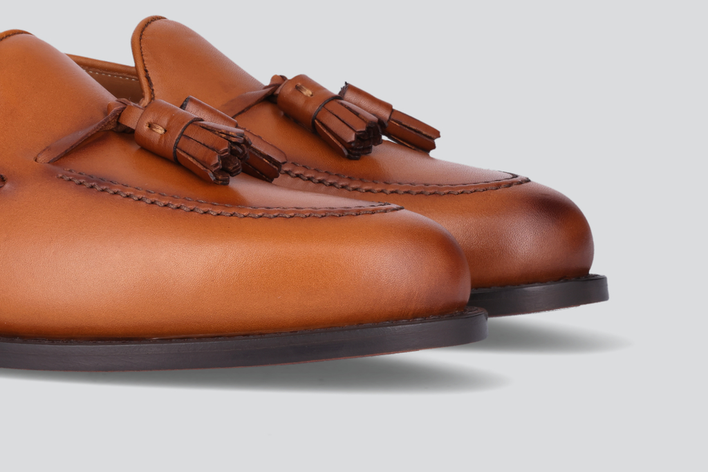 The toes of brown men's mckenna loafers from the Hartt Shoe Company