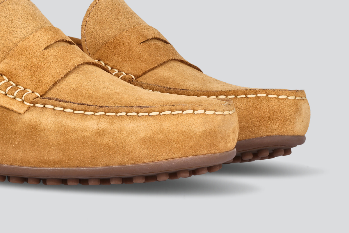 The toes of tan men's miles driver loafers from the Hartt Shoe Company