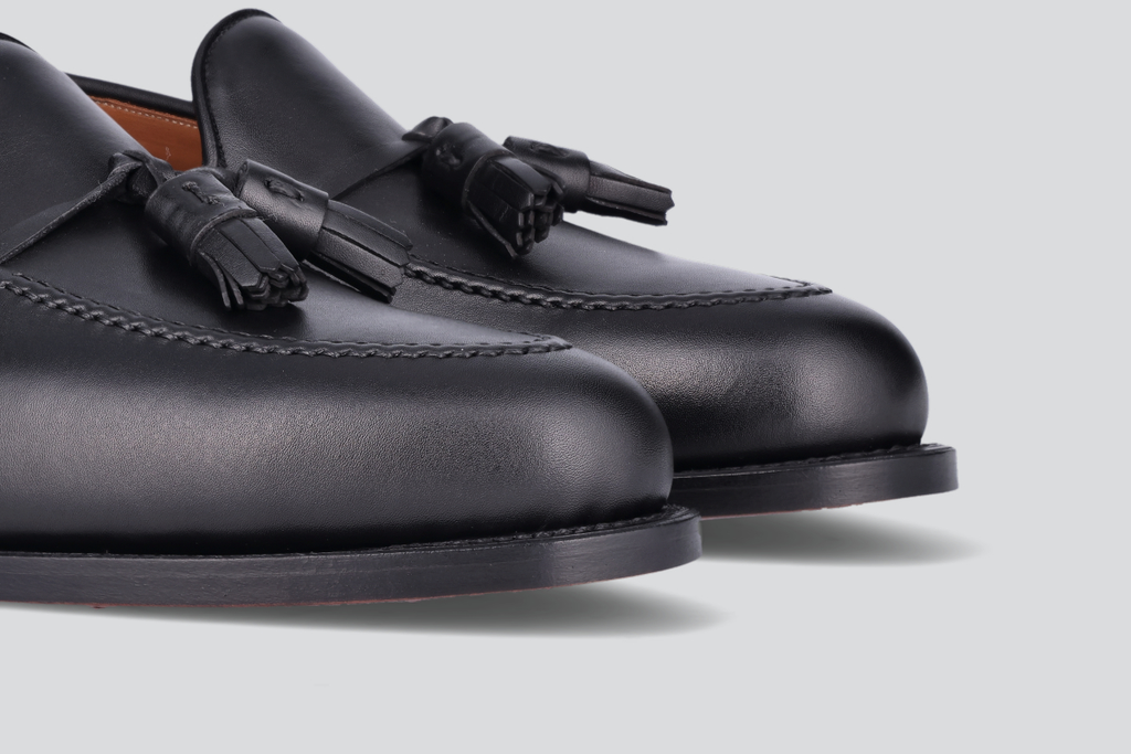 The toes of black men's mckenna loafers from the Hartt Shoe Company