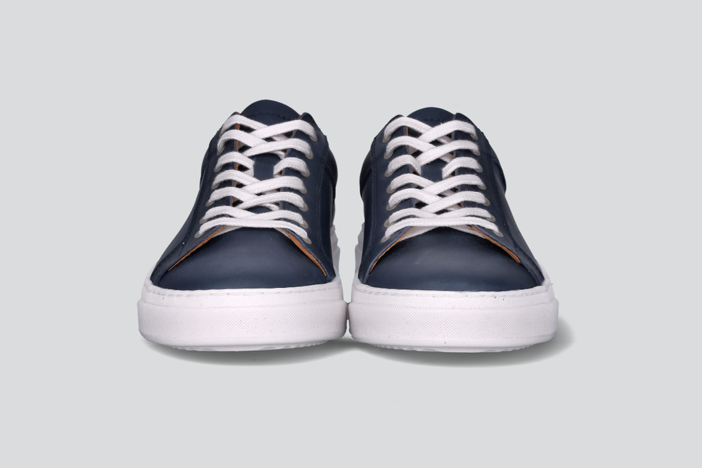 The front of navy men's low top sneaker from the Hartt Shoe Company