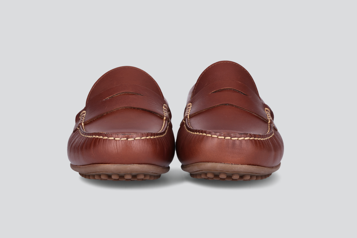 The front of a pair of bourbon men's miles driver loafers from the Hartt Shoe Company