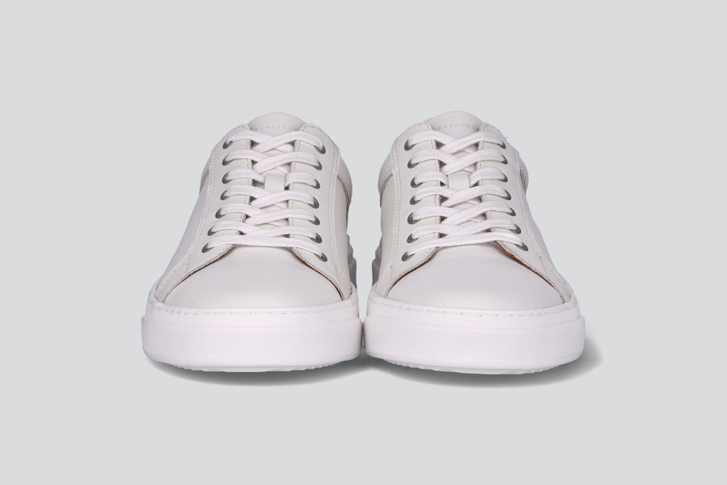 The front of white men's low top sneaker from the Hartt Shoe Company