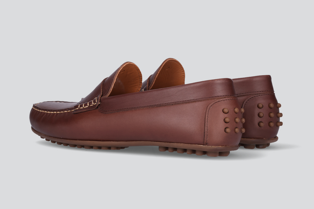 A pair of dark brown men's miles driver loafers from the Hartt Shoe Company