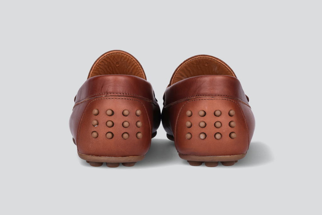 The heels of a pair of bourbon men's miles driver loafers from the Hartt Shoe Company