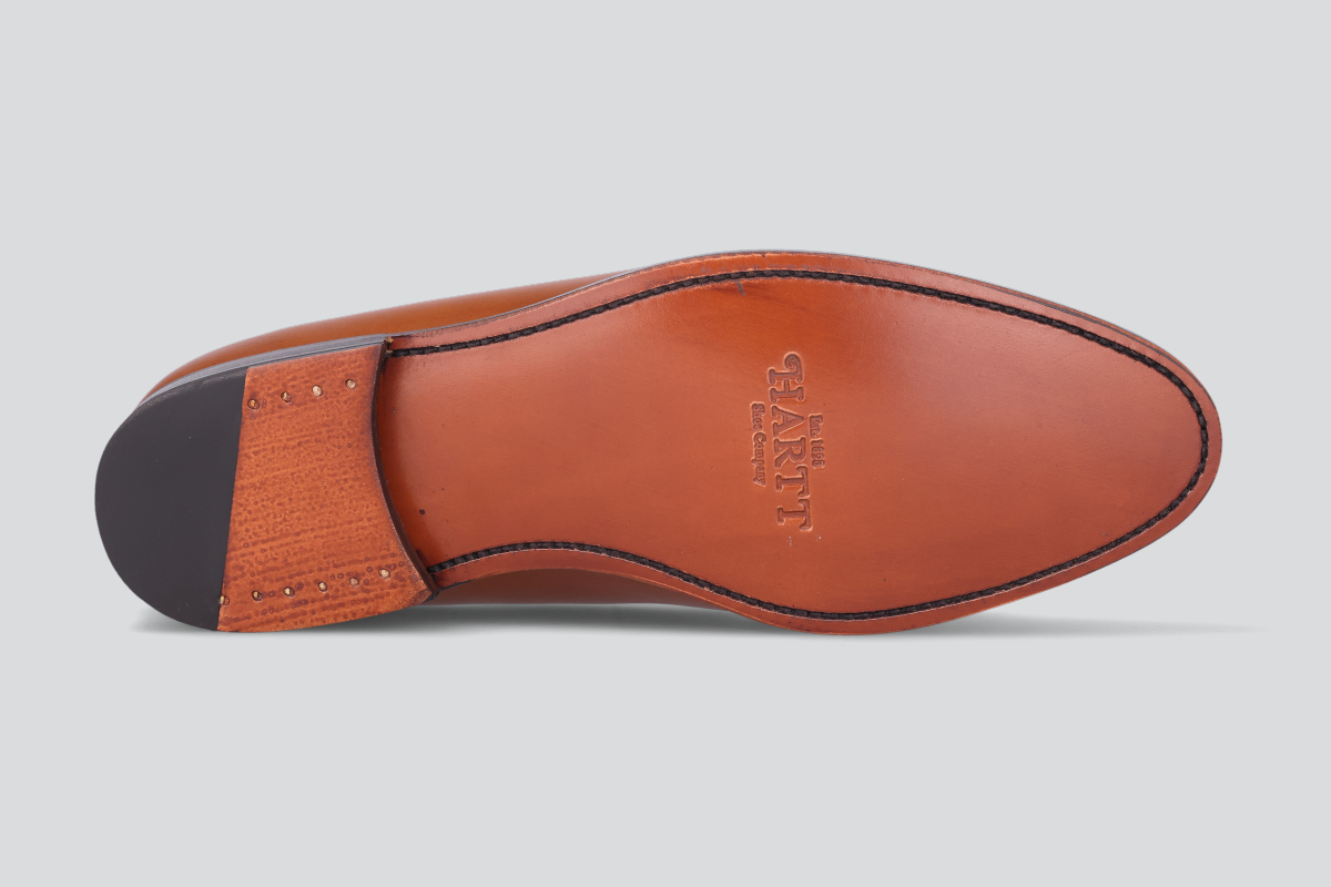 The Goodyear welted sole of a brown men's mckenna loafers from the Hartt Shoe Company
