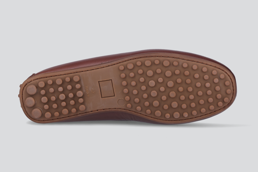 The sole of a dark brown men's miles driver loafers from the Hartt Shoe Company