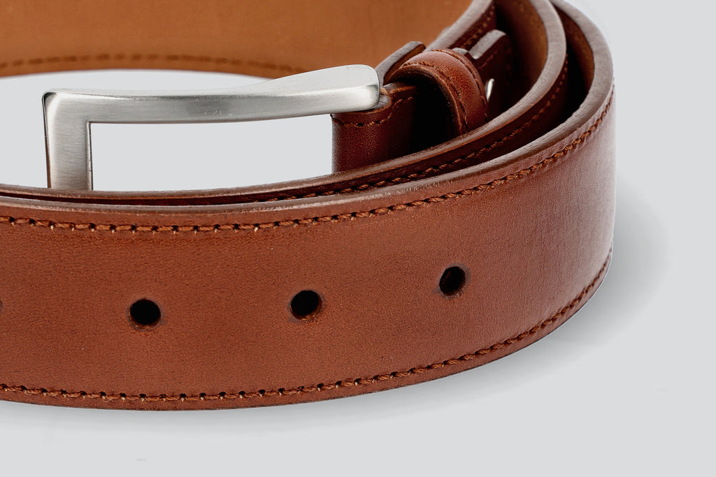 A Brown dress belt from the Hartt Shoe company