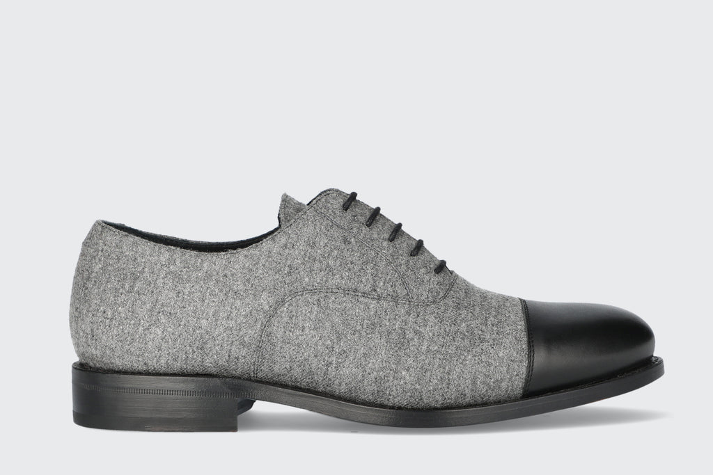 A grey and black men's dress shoe from the Hartt Shoe Company