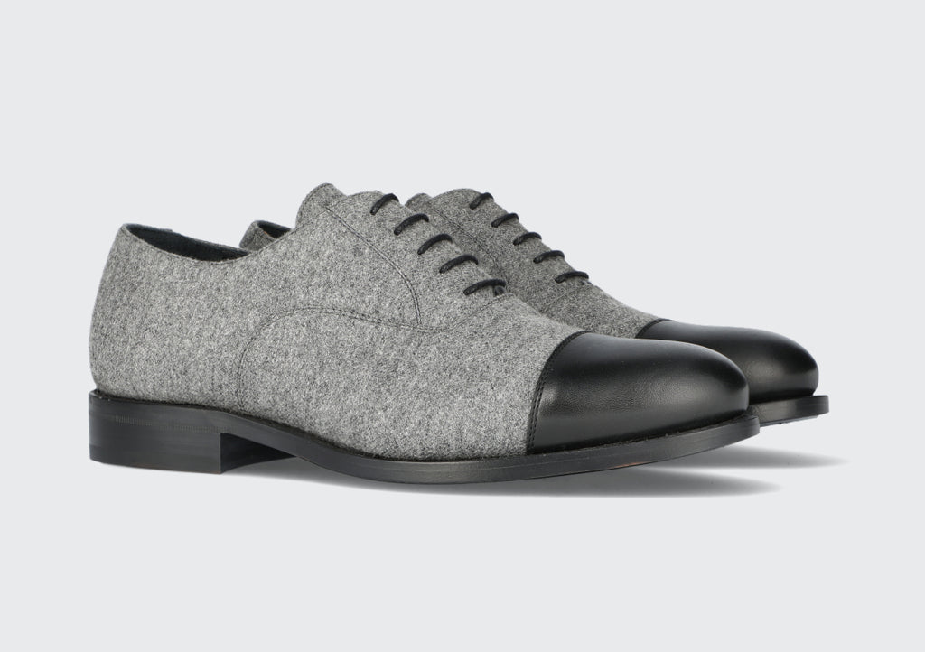 A pair of men's grey and black dress shoes from the Hartt Shoe Company
