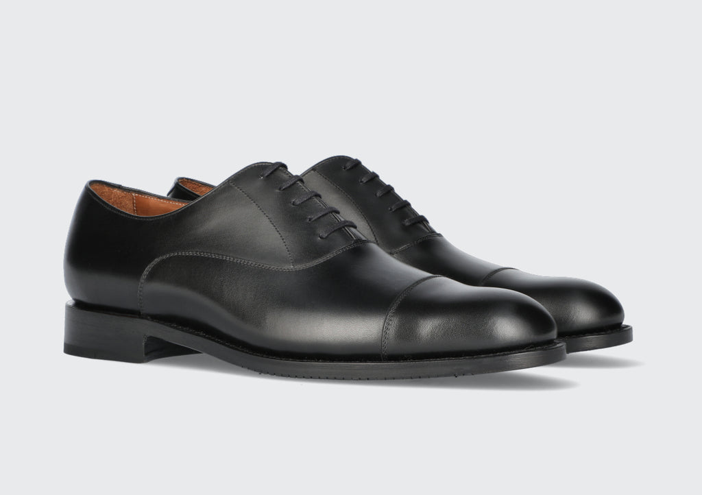 A pair of black men's oxford dress shoes from the Hartt Shoe Company