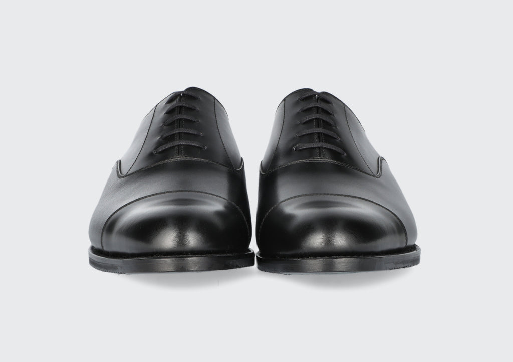 The front of a pair of men's black oxfords from the Hartt Shoe Company
