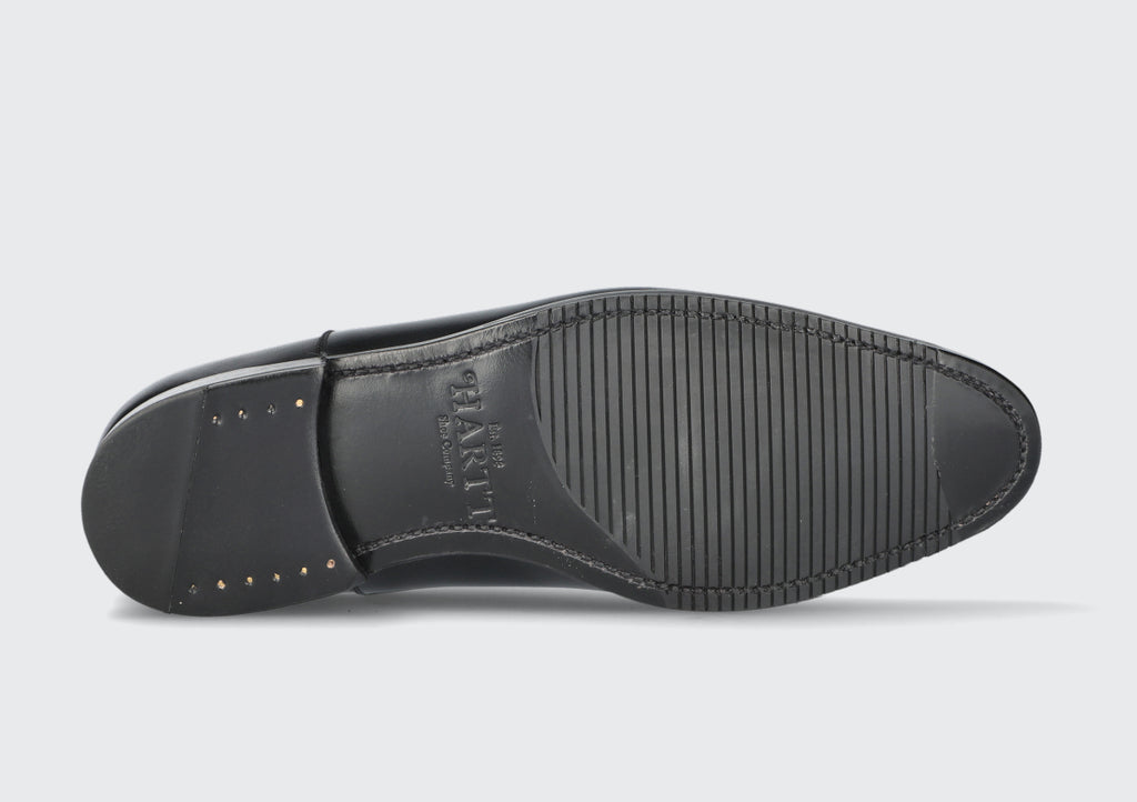 The Goodyear welted sole of a black men's dress shoe from the Hartt Shoe Company
