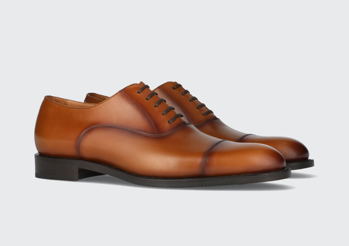 A pair of brown men's dress shoes from the Hartt Shoe Company