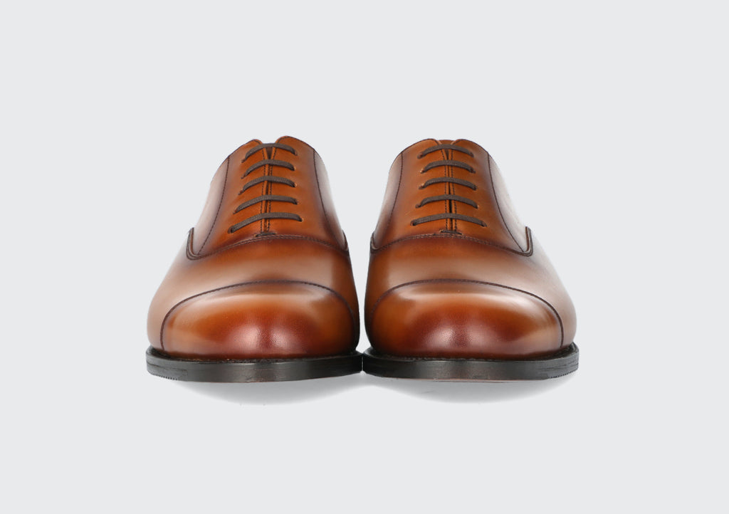 The front of a pair of men's leather dress shoes made by the Hartt Shoe Company