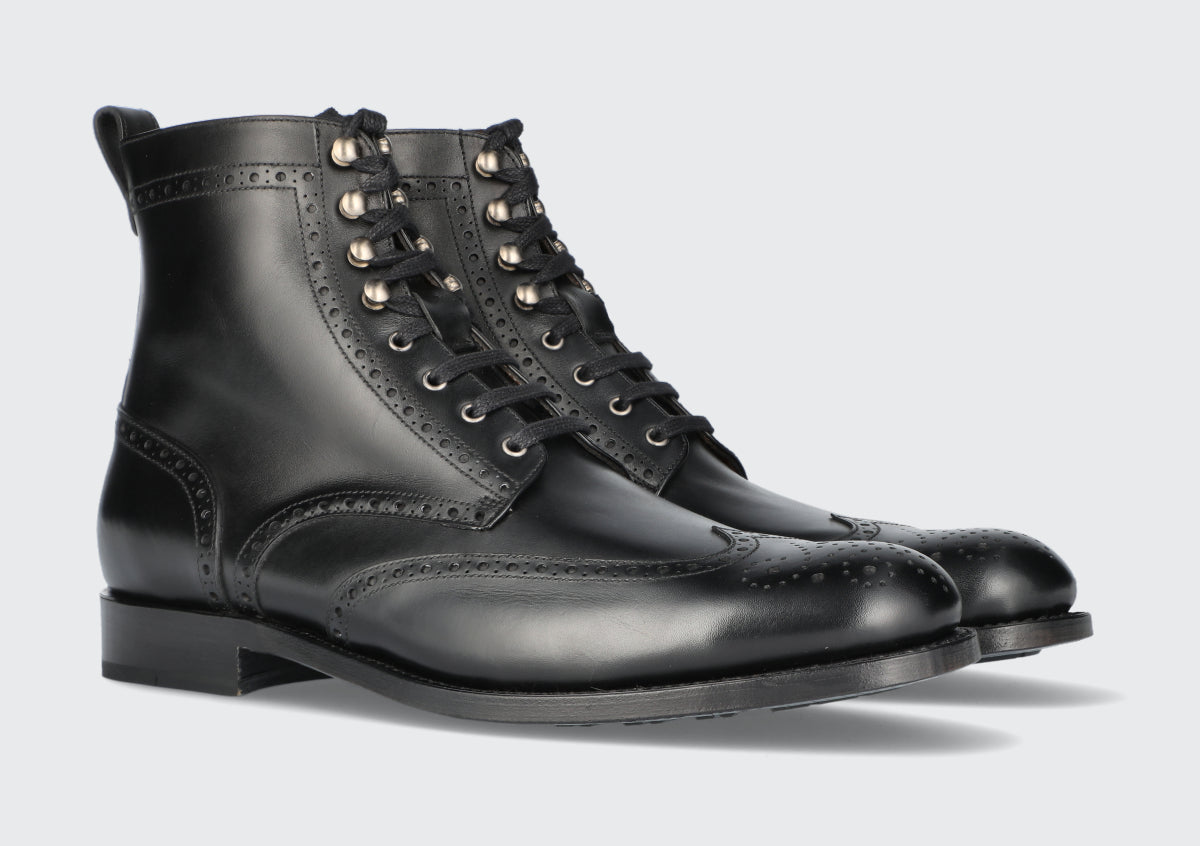 A pair of black leather dress boots from the Hartt Shoe Company