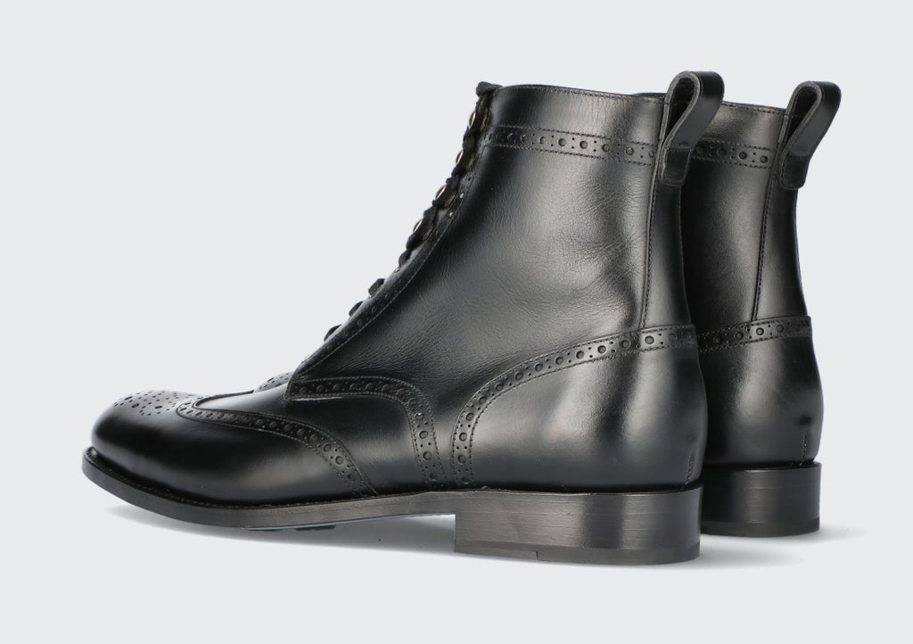 A pair of black men's dress boots from the Hartt Shoe Company