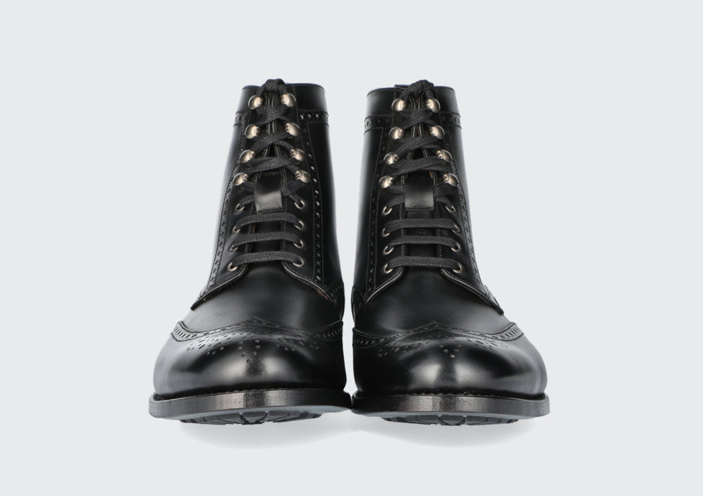 The front of a pair of black men's dress boots from the Hartt Shoe Company
