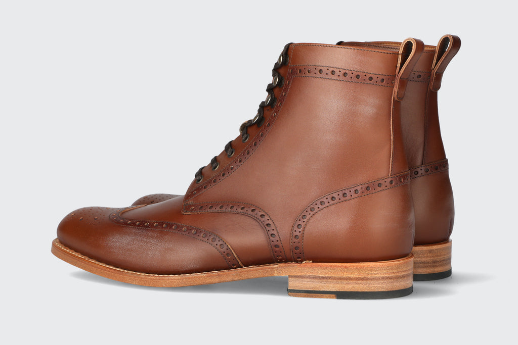 A pair of men's brown leather boots from the Hartt Shoe company