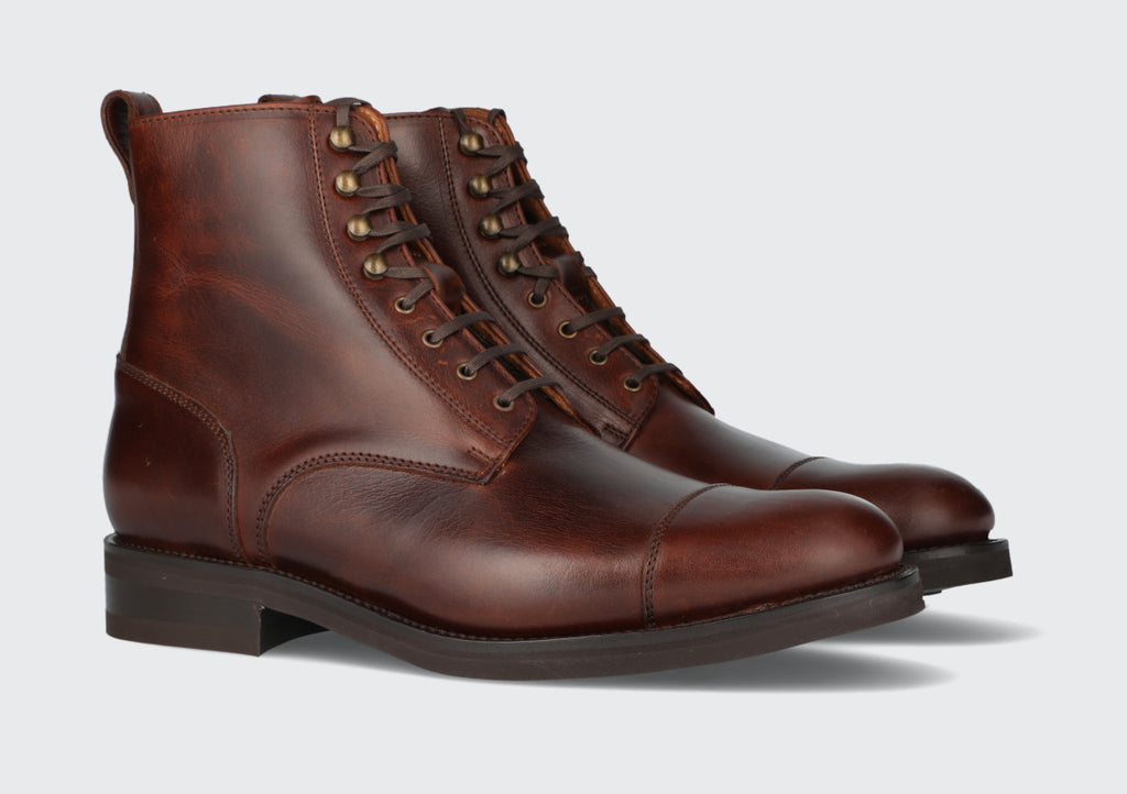 A pair of men's oxblood leather dress boots from the Hartt Shoe Company